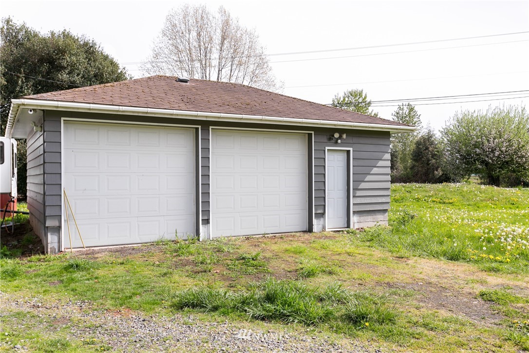776 West Smith Road Bellingham, WA 98226 - Photo 27 of 29 a backyard of a house with lots of green space