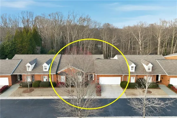 an aerial view of a house with swimming pool and outdoor space