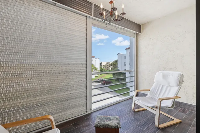 a view of a room with wooden floor wooden table and chairs
