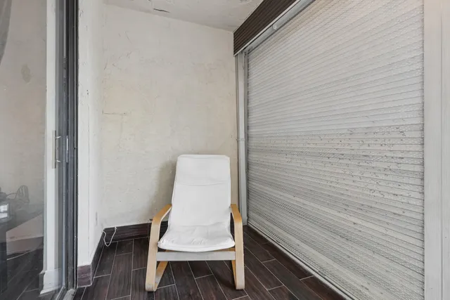 a bench sitting in a bathroom next to a wooden wall