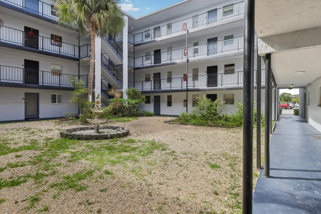 a view of a building with a yard