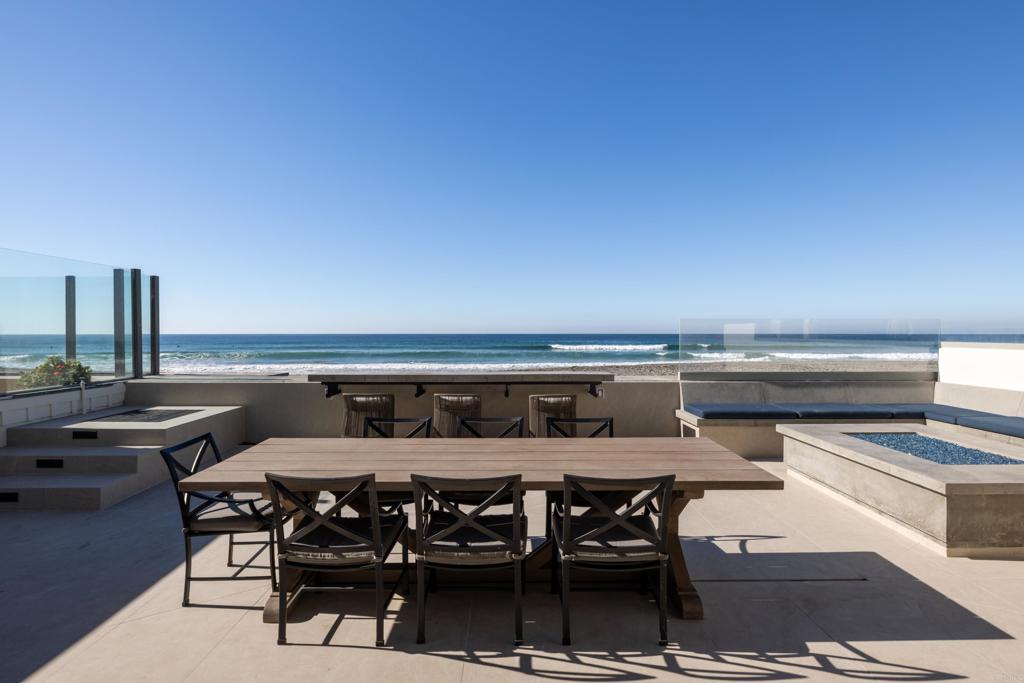 2016 Ocean Front Del Mar, CA 92014 - Photo 9 of 12 a view of a chairs and table on the terrace