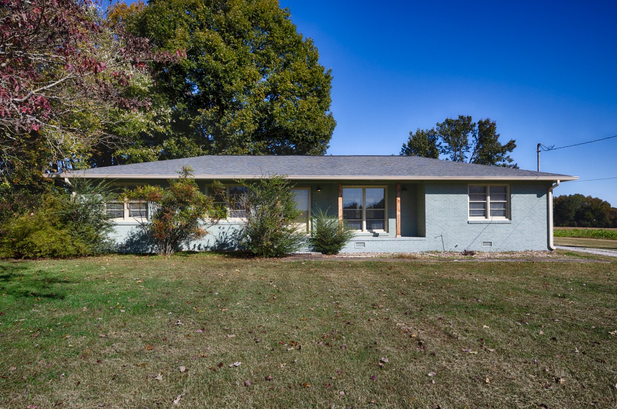 1969 Bobo Section Road Hazel Green, AL 35750 - Photo 35 of 47 a front view of a house with garden