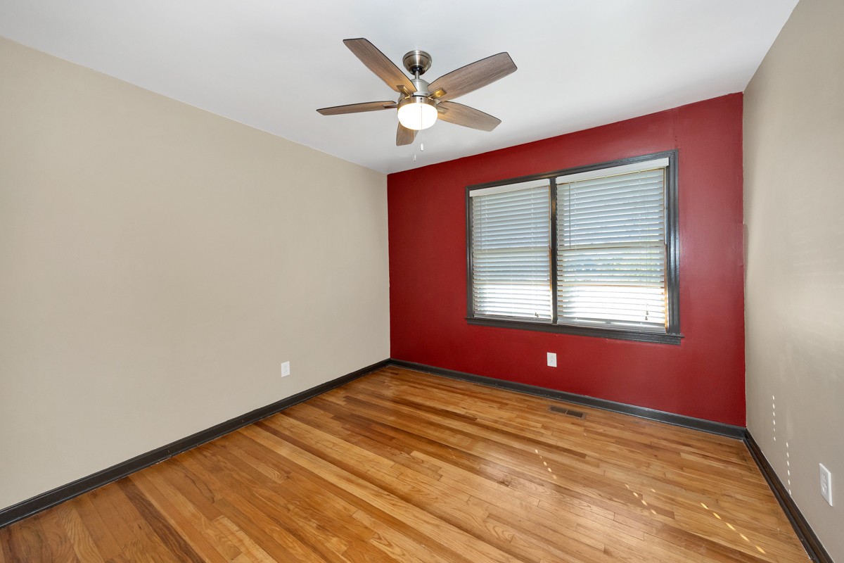 1969 Bobo Section Road Hazel Green, AL 35750 - Photo 7 of 47 a view of an empty room with window and ceiling fan
