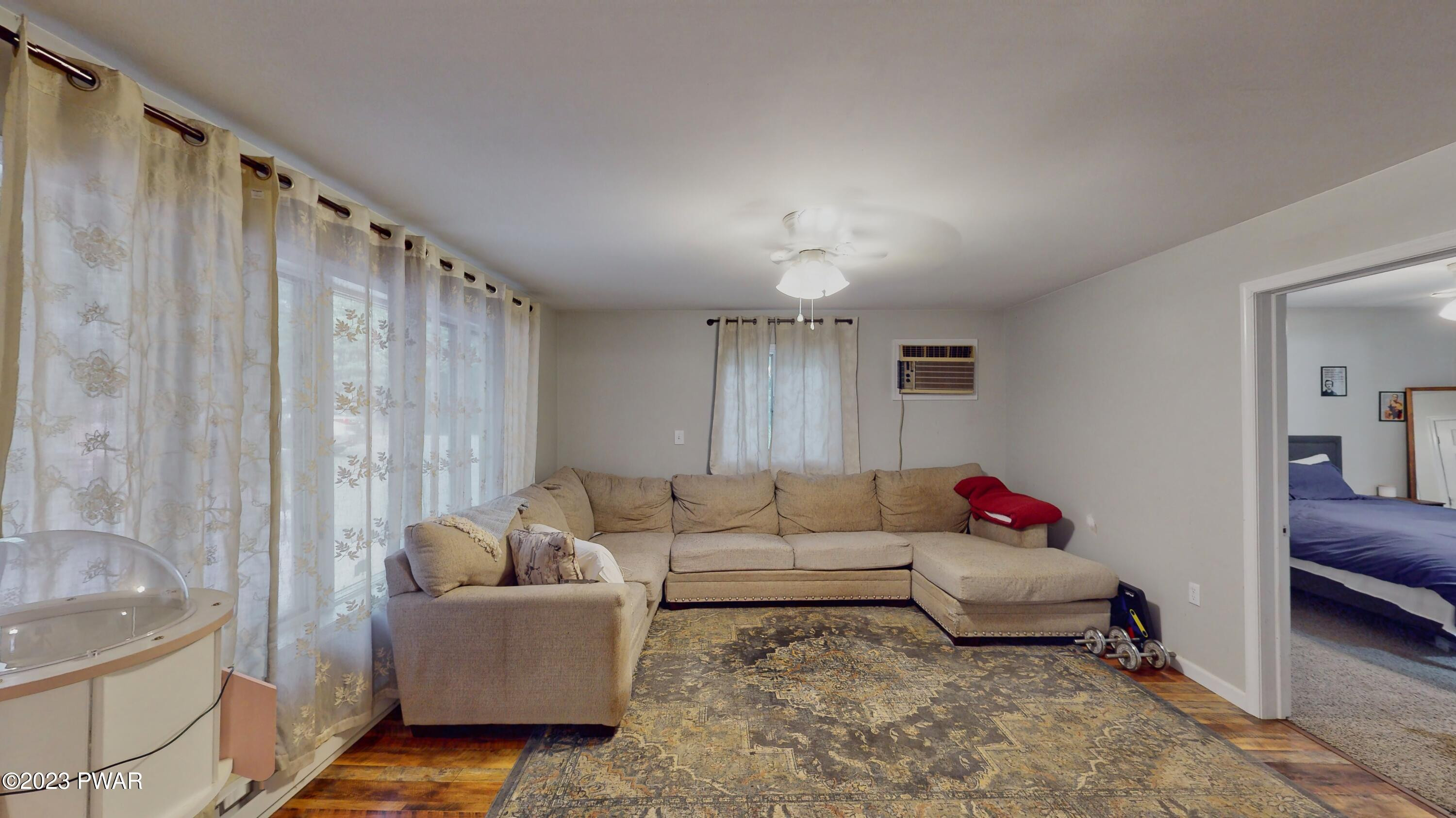 149 Walker Lake Road Shohola, PA 18458 - Photo 4 of 51 a living room with furniture and a window