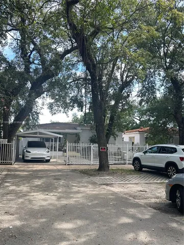 a view of street with parked cars
