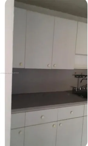 a living room with granite countertop and couch