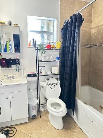 a bedroom with a bed and a chair