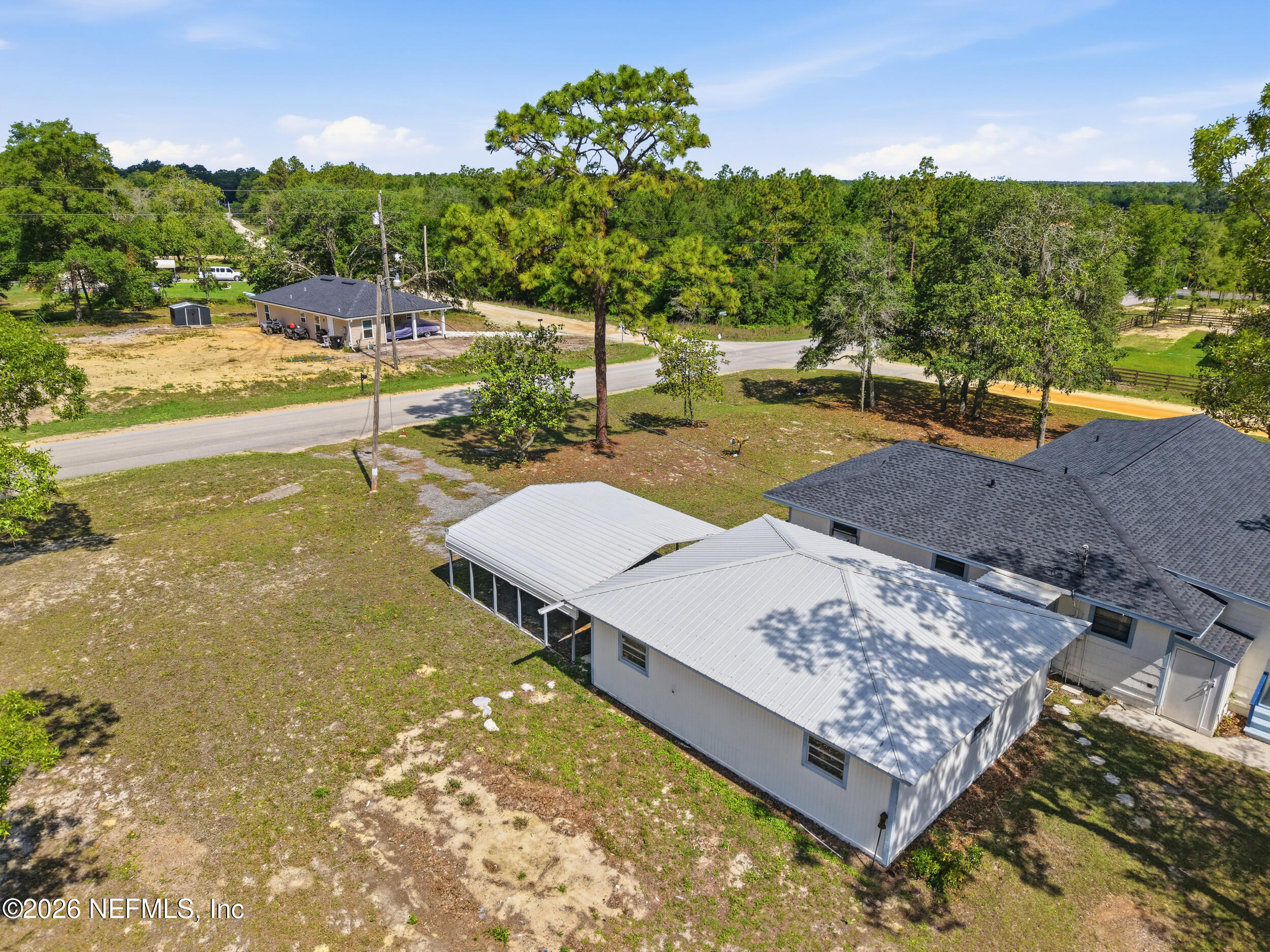 7593 Silver Sands Road Keystone Heights, FL 32656 - Photo 30 of 36 a view of a yard with an outdoor space