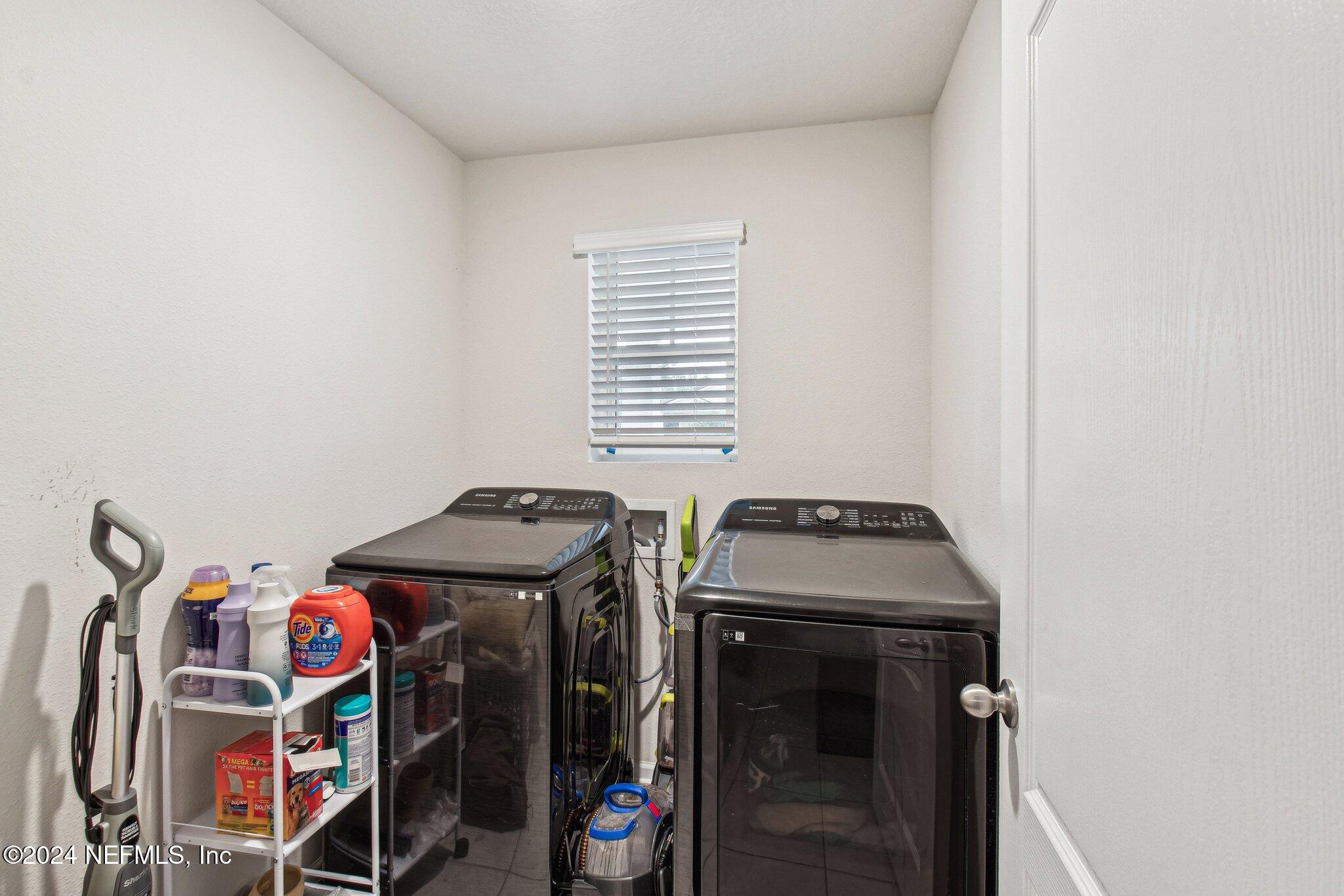 86253 Mainline Road Yulee, FL 32097 - Photo 32 of 39 a utility room with dryer and washer