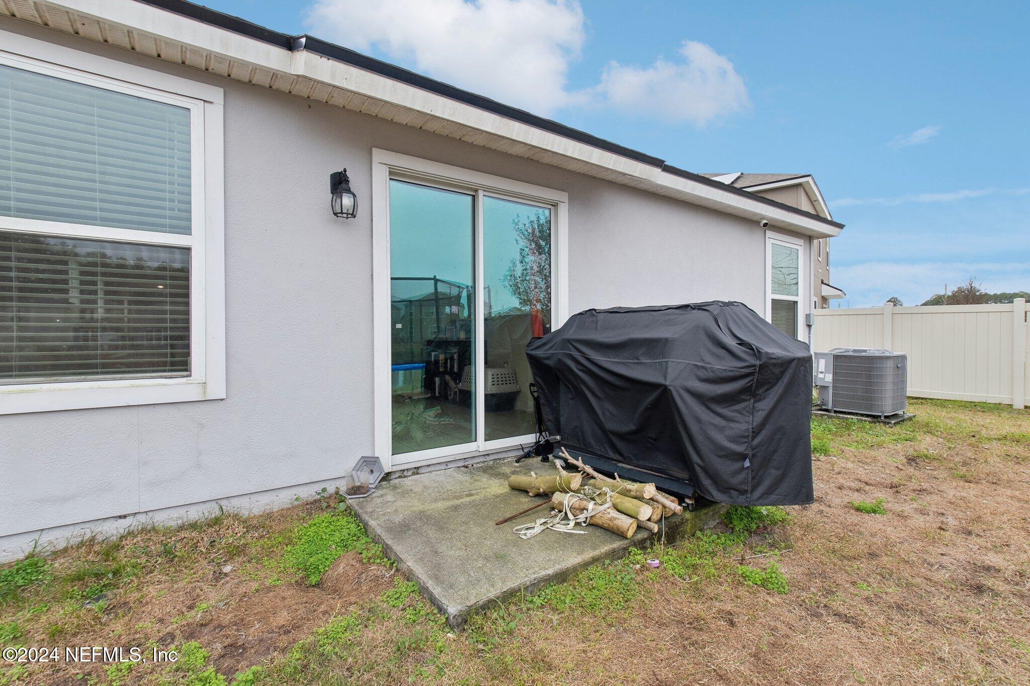 86253 Mainline Road Yulee, FL 32097 - Photo 35 of 39 a house view with a garden space