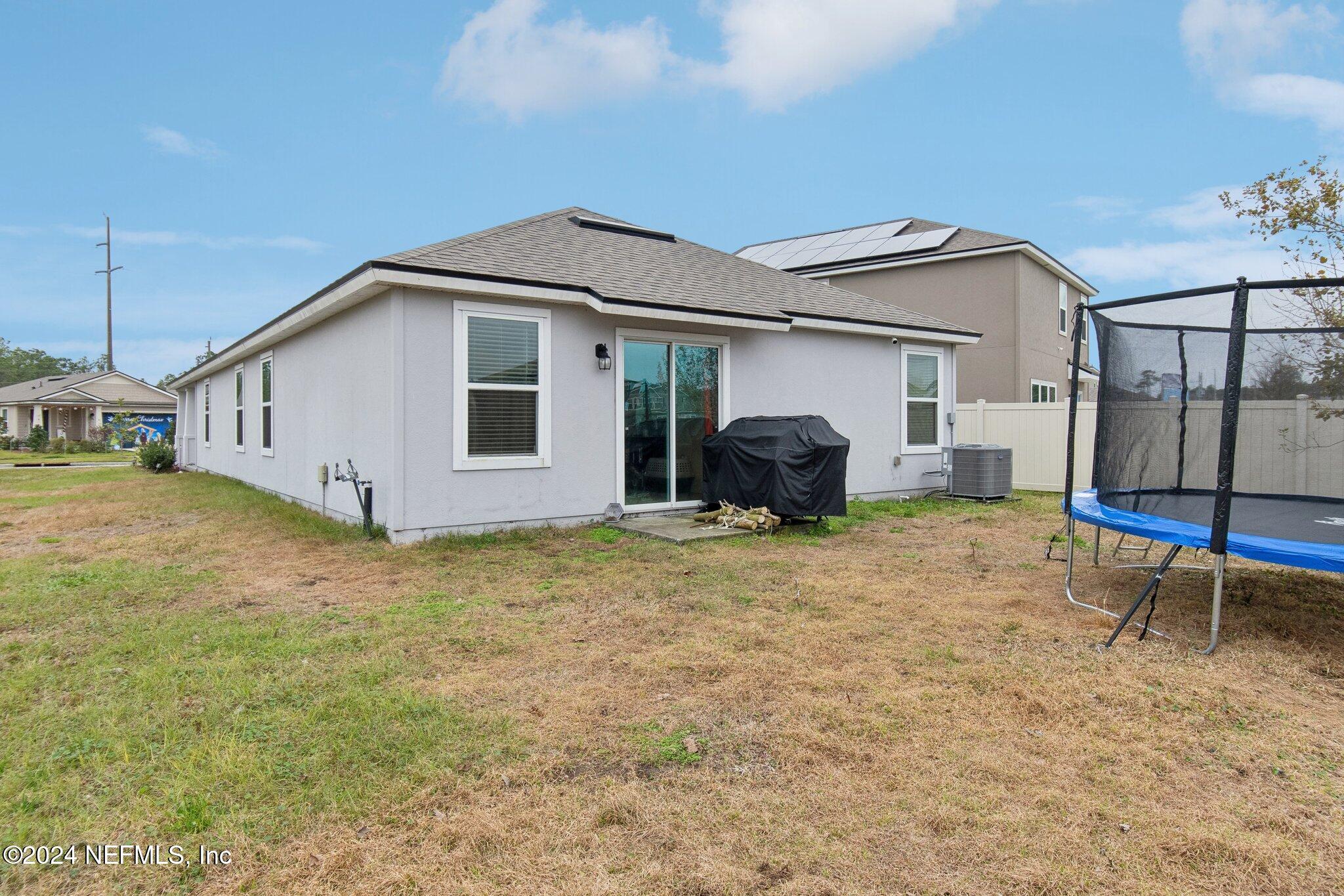 86253 Mainline Road Yulee, FL 32097 - Photo 37 of 39 a house view with a backyard space