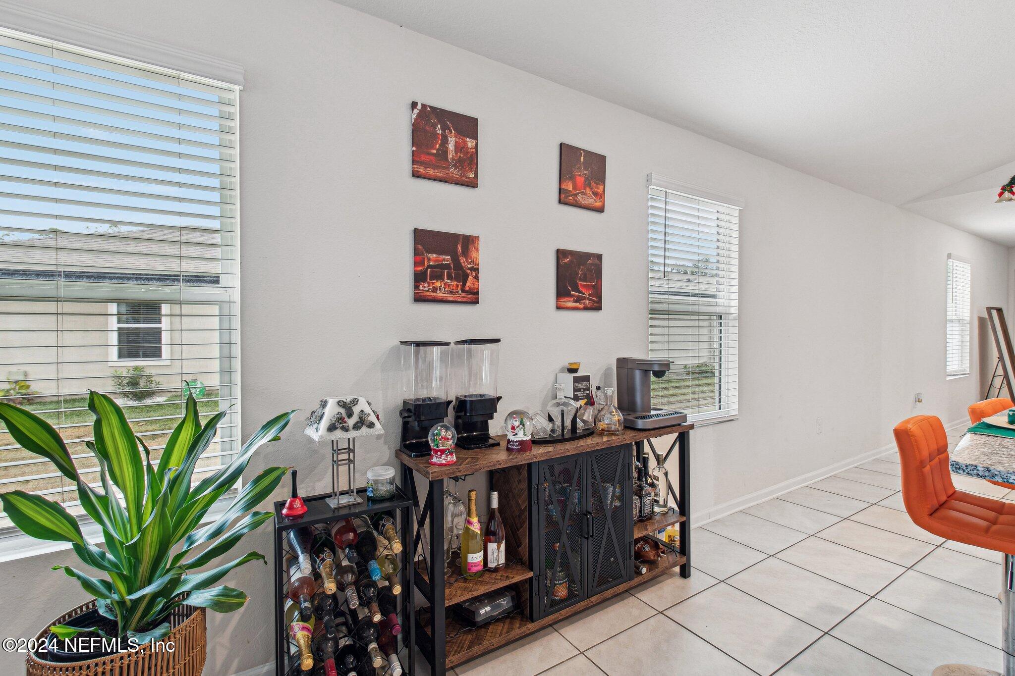 86253 Mainline Road Yulee, FL 32097 - Photo 10 of 39 a front view of a house with garden