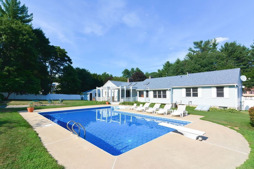 59 Breckenridge Road Tewksbury, MA 01876 - Photo 11 of 42 a view of a house with pool and chairs