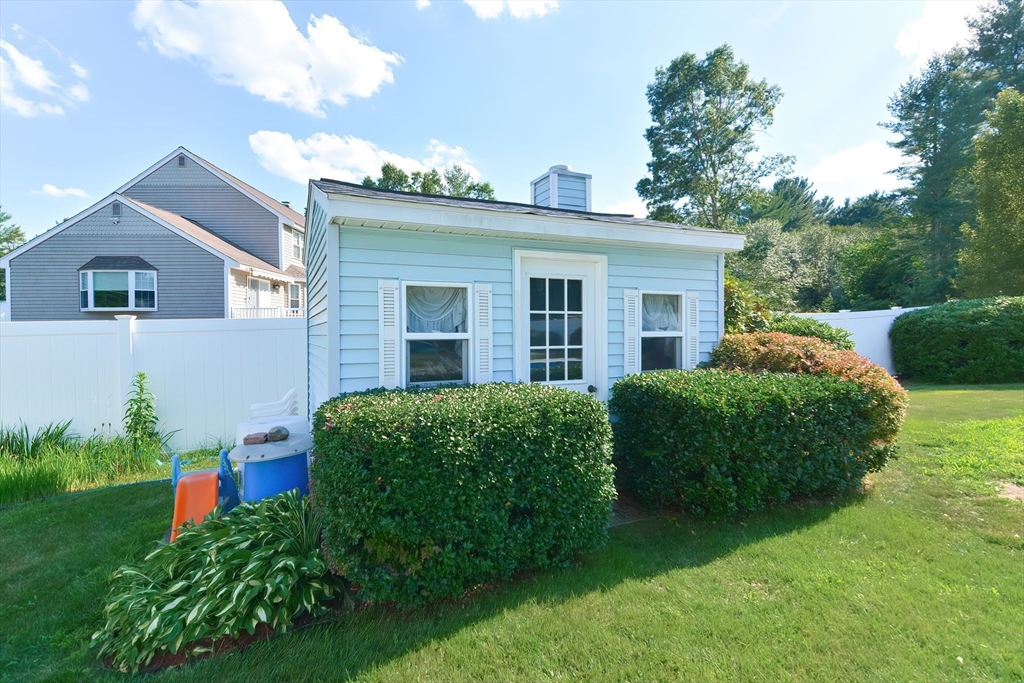 59 Breckenridge Road Tewksbury, MA 01876 - Photo 12 of 42 a front view of a house with garden
