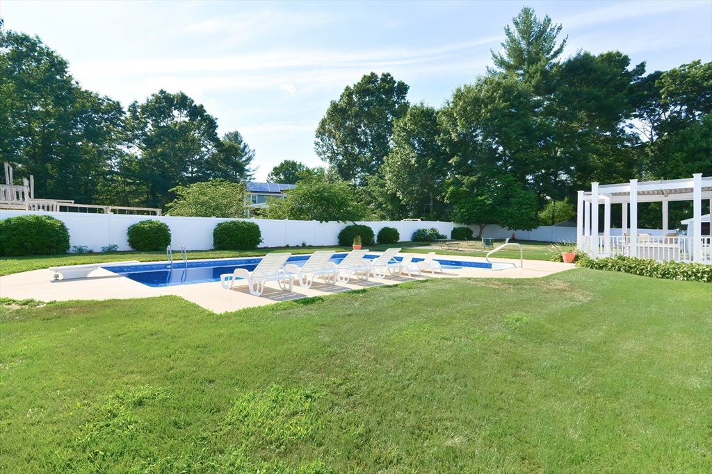 59 Breckenridge Road Tewksbury, MA 01876 - Photo 13 of 42 a view of a house with a back yard