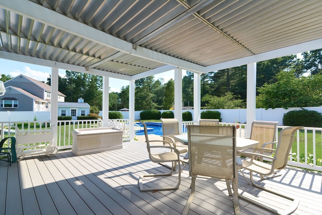 59 Breckenridge Road Tewksbury, MA 01876 - Photo 15 of 42 a view of a patio with chairs and wooden floor