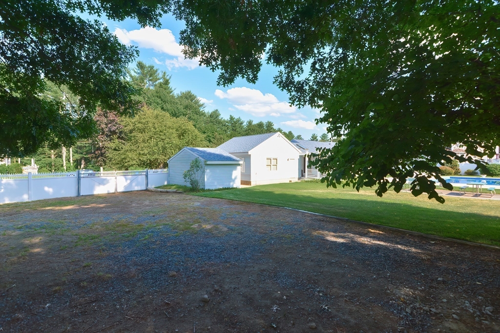 59 Breckenridge Road Tewksbury, MA 01876 - Photo 17 of 42 a view of backyard of house with trees
