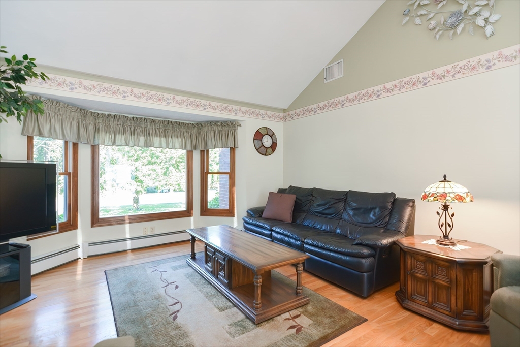 59 Breckenridge Road Tewksbury, MA 01876 - Photo 20 of 42 a living room with furniture and a flat screen tv
