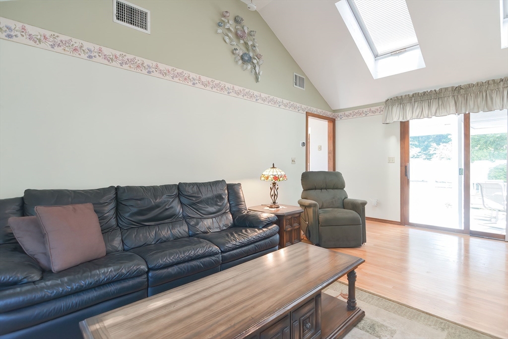 59 Breckenridge Road Tewksbury, MA 01876 - Photo 21 of 42 a living room with furniture and a window
