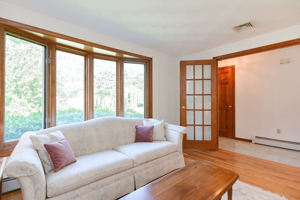 59 Breckenridge Road Tewksbury, MA 01876 - Photo 27 of 42 a living room with furniture and a large window