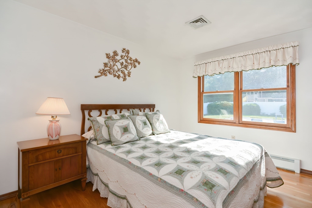 59 Breckenridge Road Tewksbury, MA 01876 - Photo 28 of 42 a large bed sitting in a bedroom next to a window