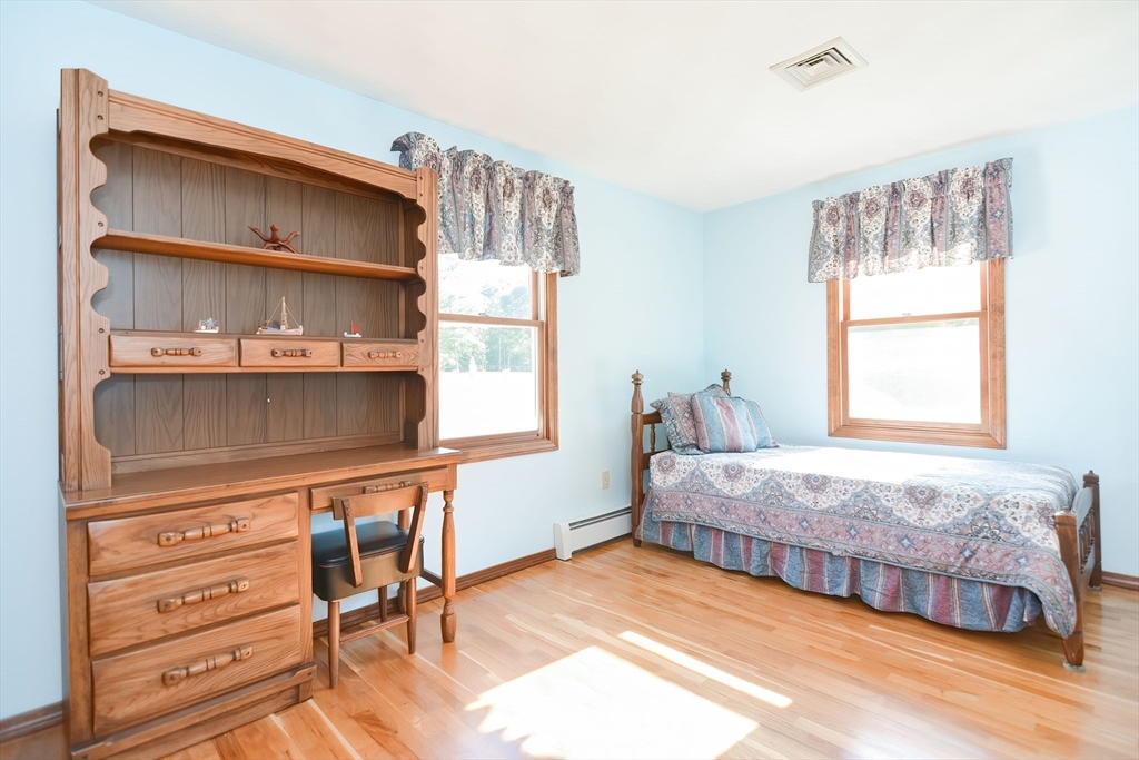 59 Breckenridge Road Tewksbury, MA 01876 - Photo 32 of 42 a bedroom with a bed and a window