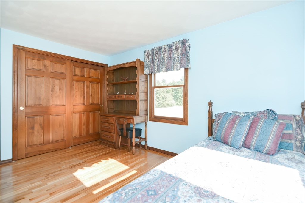 59 Breckenridge Road Tewksbury, MA 01876 - Photo 33 of 42 a bedroom with a bed and a window