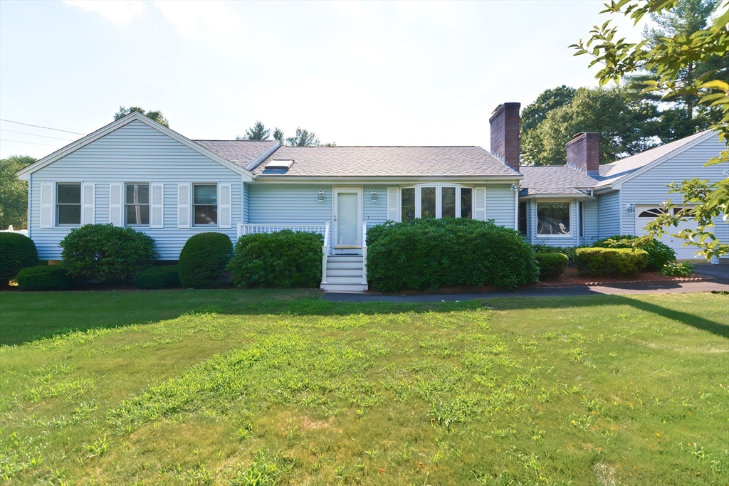 59 Breckenridge Road Tewksbury, MA 01876 - Photo 5 of 42 a front view of a house with garden