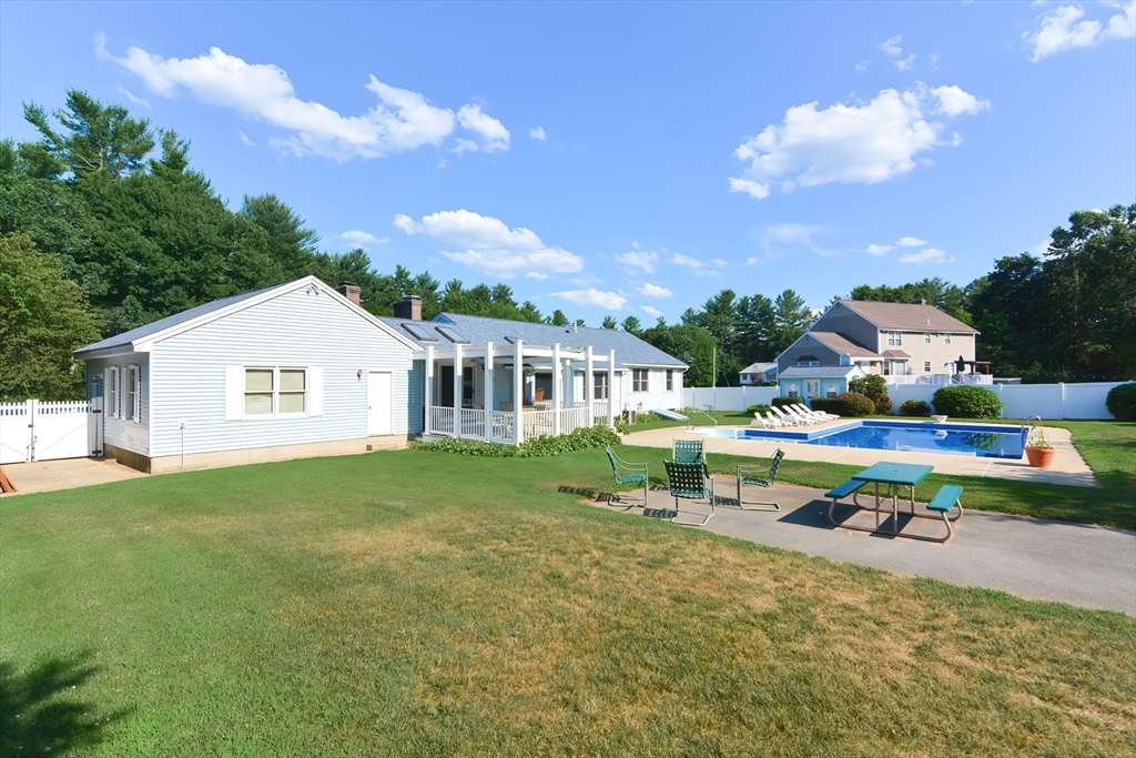 59 Breckenridge Road Tewksbury, MA 01876 - Photo 8 of 42 a view of a house with a yard