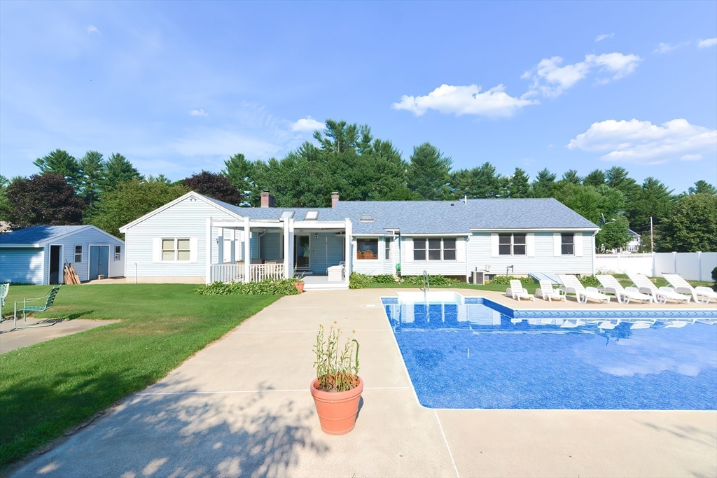 59 Breckenridge Road Tewksbury, MA 01876 - Photo 10 of 42 a view of house with yard and swimming pool