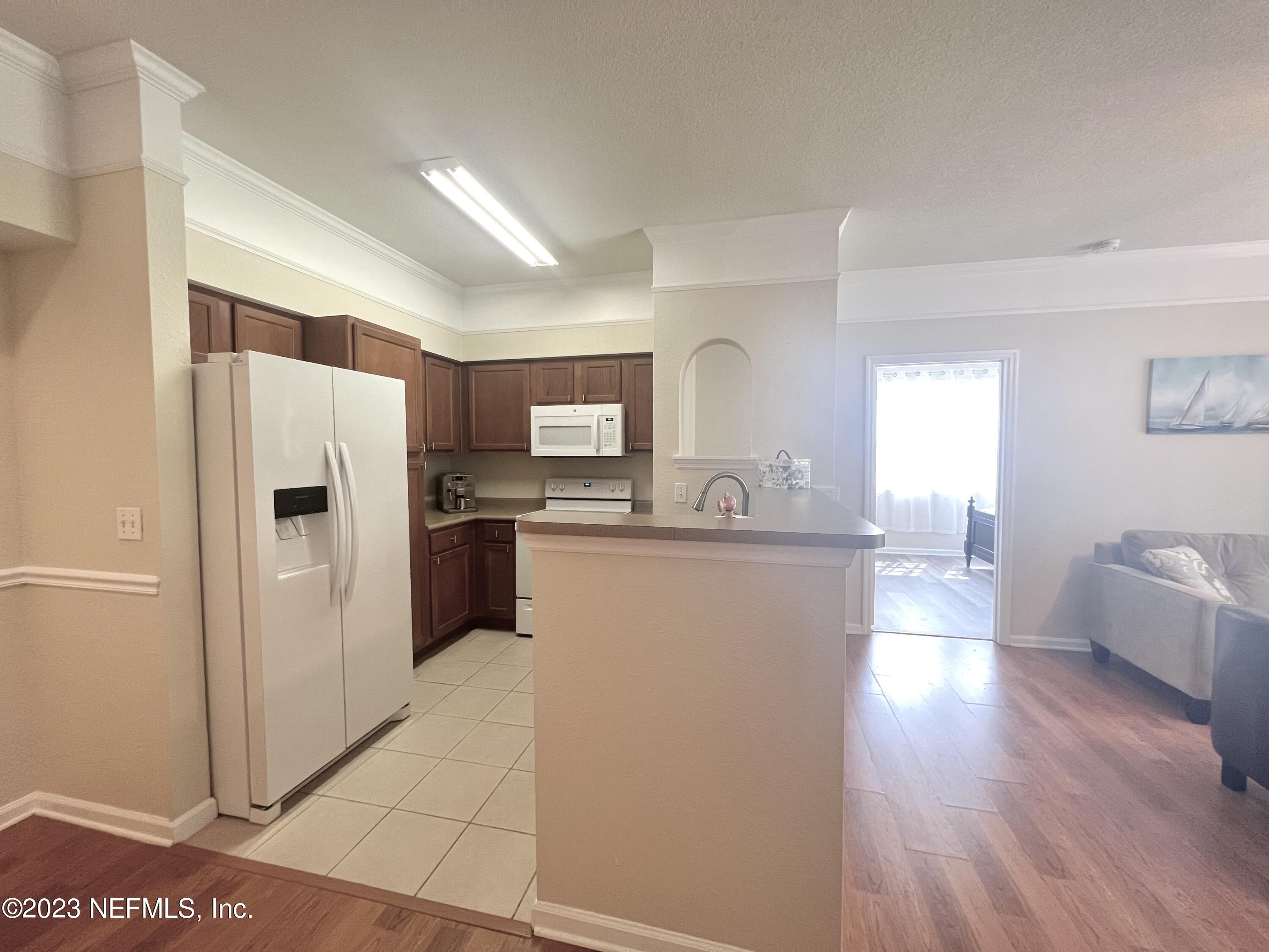8550 Touchton Road, Unit 1812 Jacksonville, FL 32216 - Photo 7 of 30 Kitchen to Bedroom