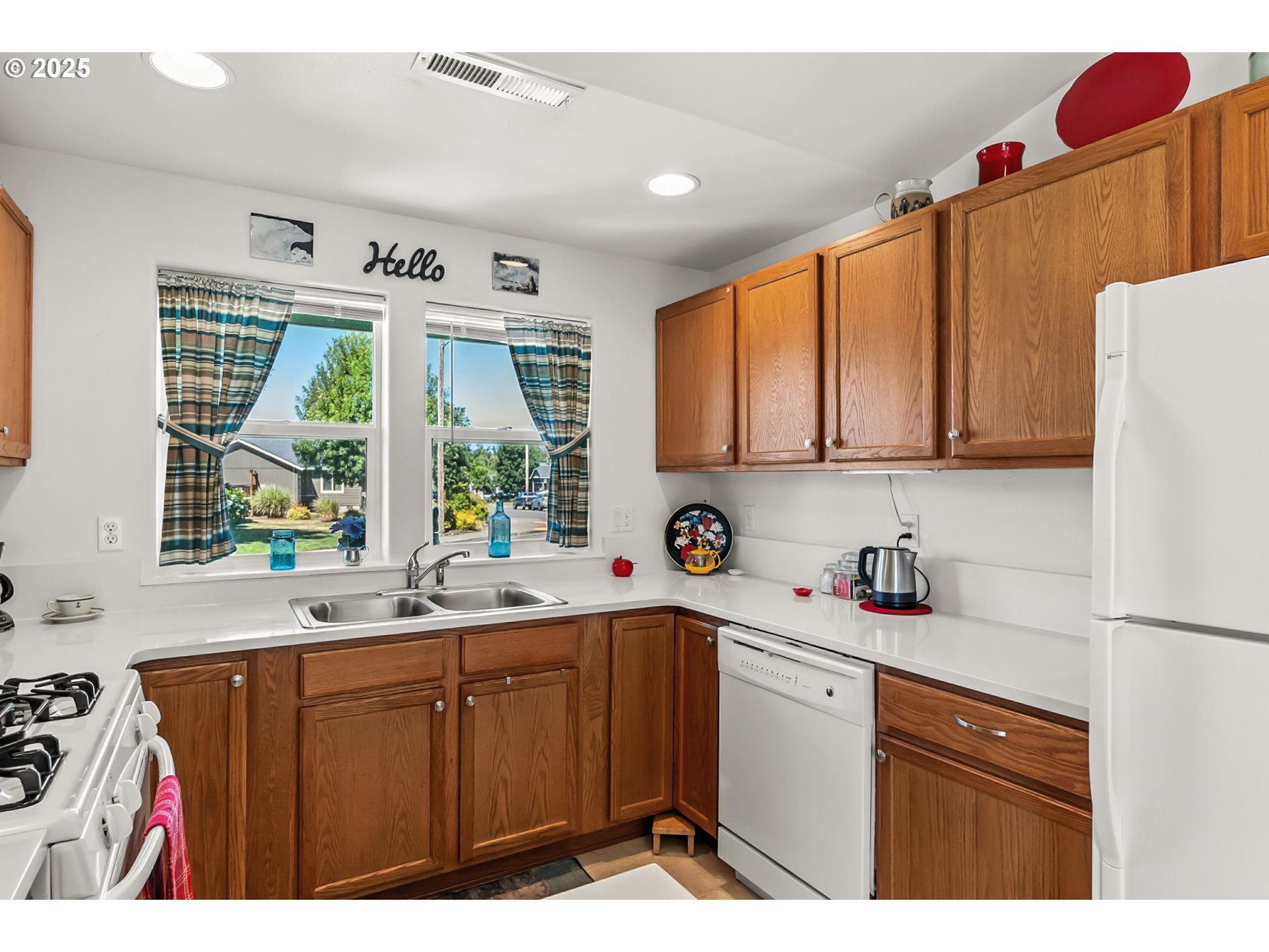 1933 South 58th Street Springfield, OR 97478 - Photo 11 of 32 a kitchen with a window a sink and a refrigerator