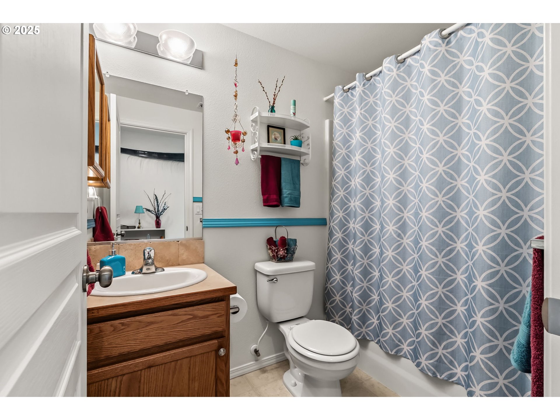 1933 South 58th Street Springfield, OR 97478 - Photo 12 of 32 a bathroom with a sink toilet and mirror