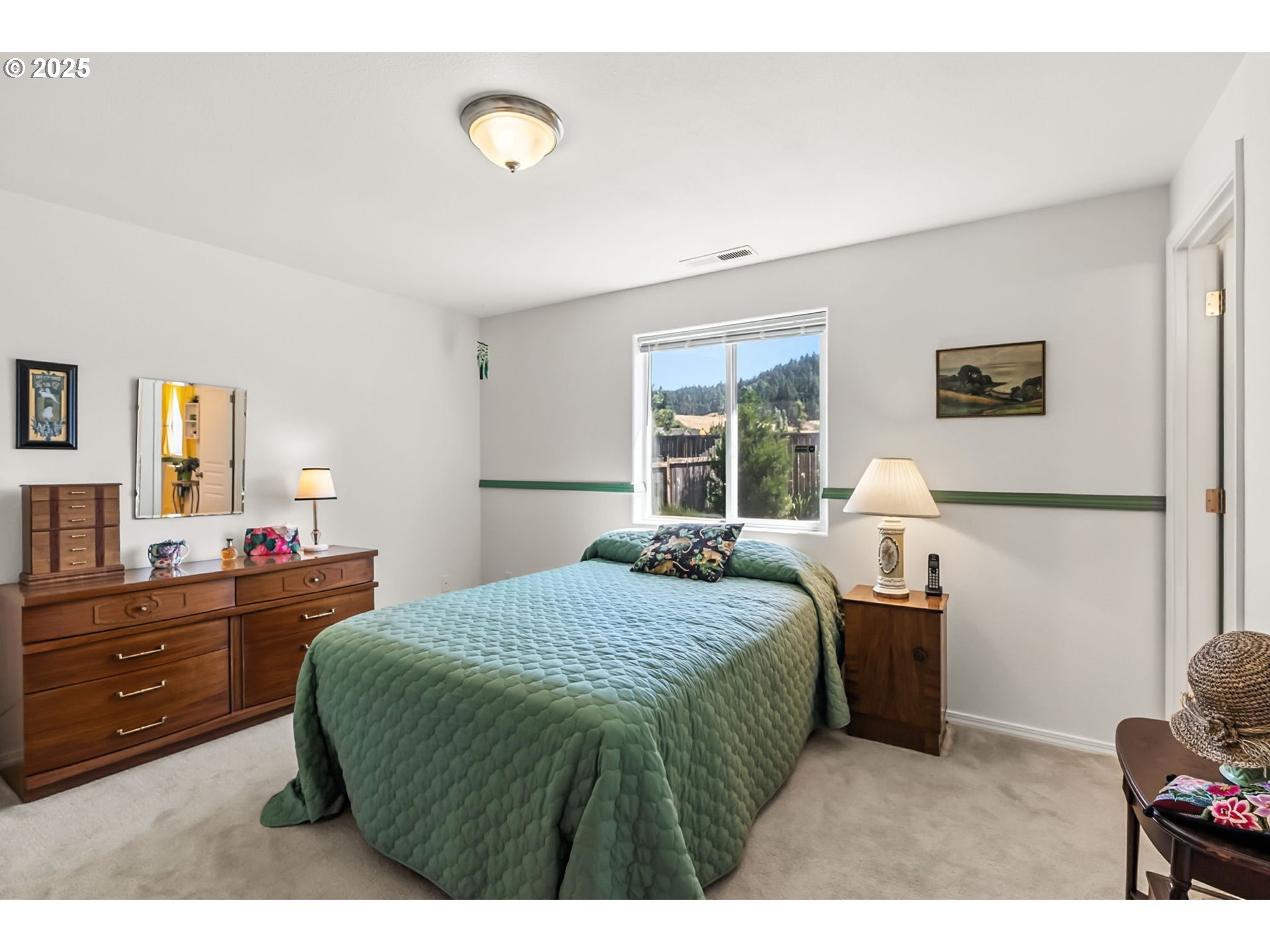 1933 South 58th Street Springfield, OR 97478 - Photo 13 of 32 a bedroom with a bed and a dresser