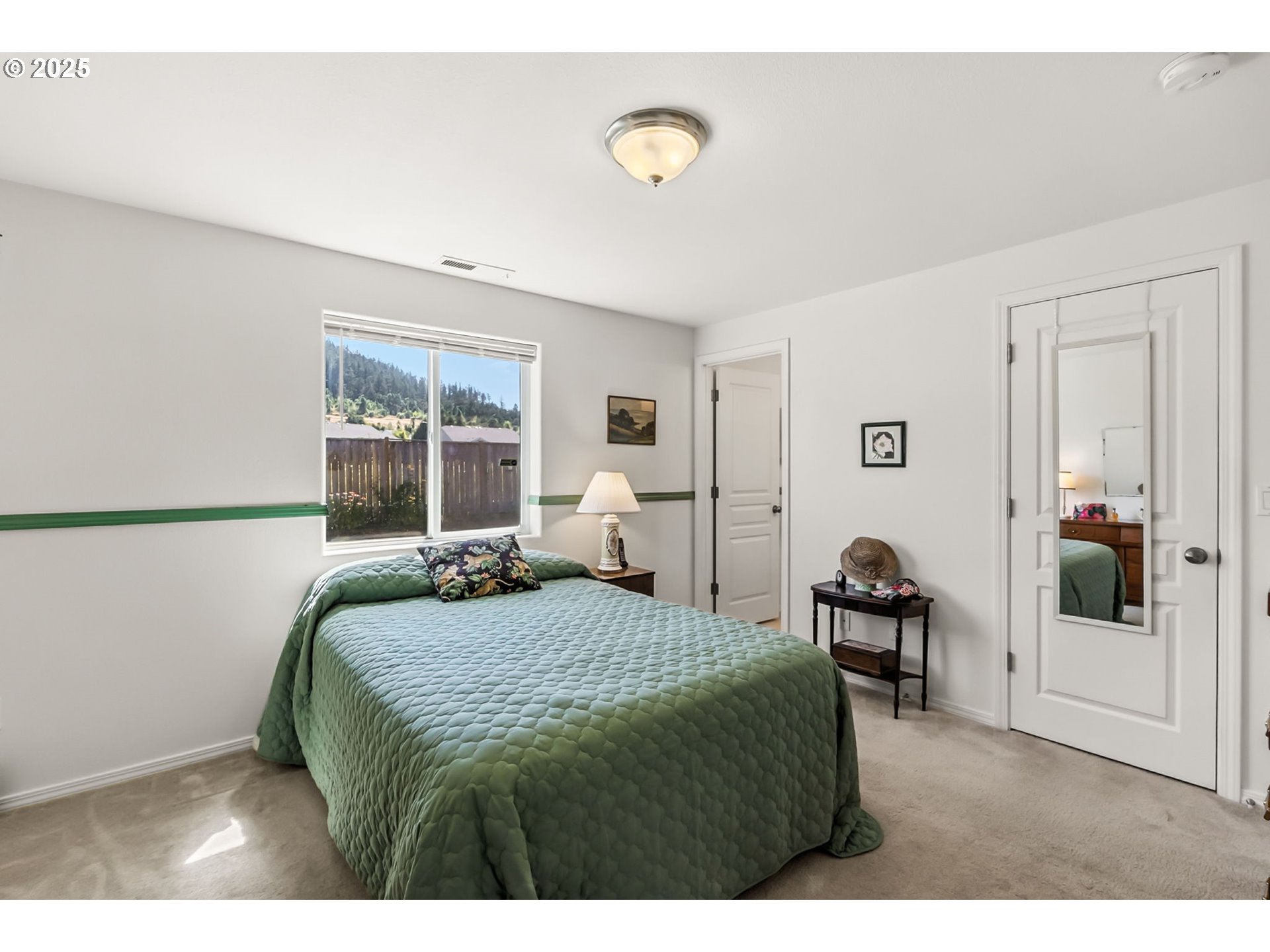 1933 South 58th Street Springfield, OR 97478 - Photo 14 of 32 a bedroom with a bed and window