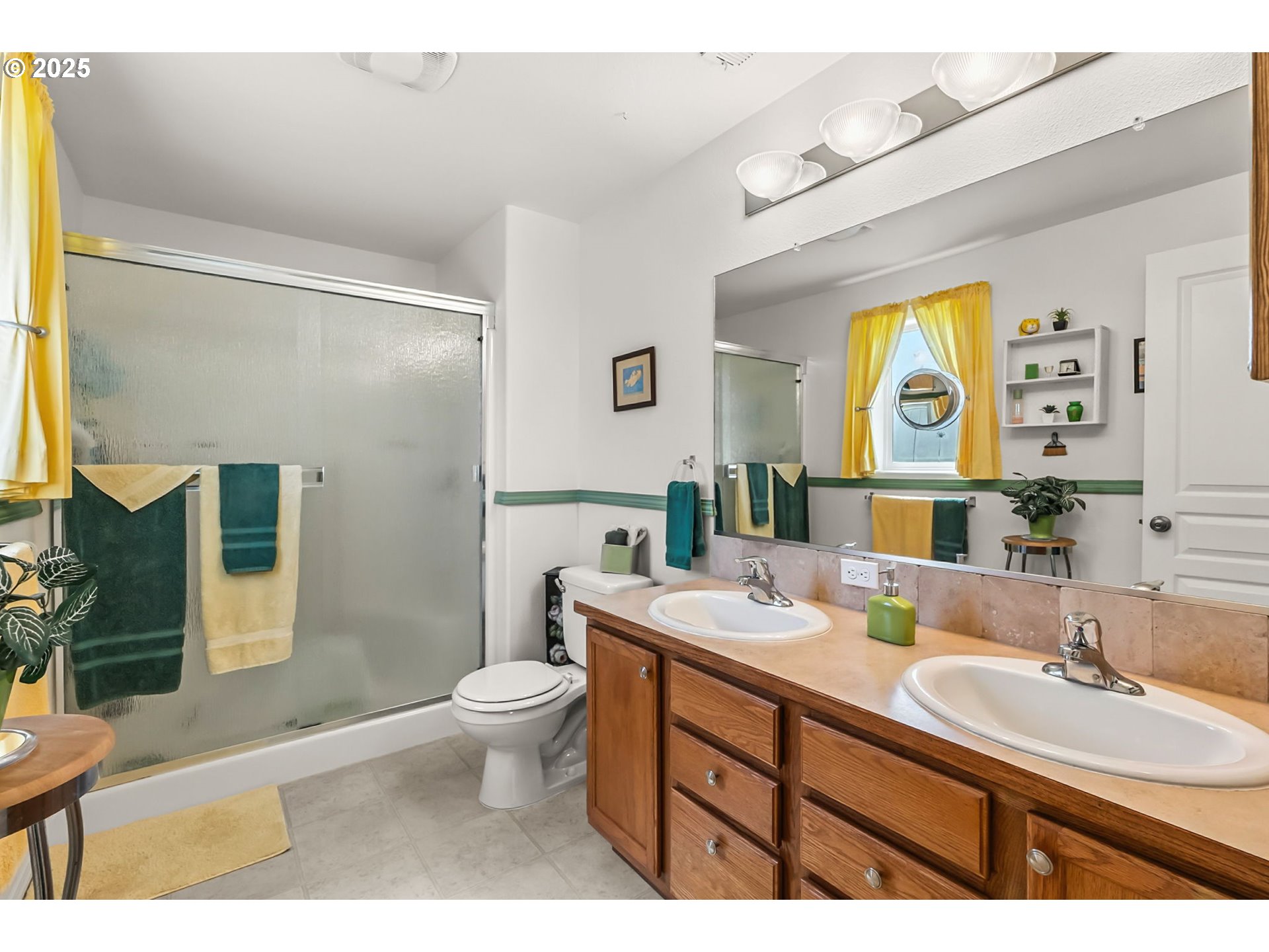 1933 South 58th Street Springfield, OR 97478 - Photo 16 of 32 a bathroom with a granite countertop sink mirror vanity and toilet