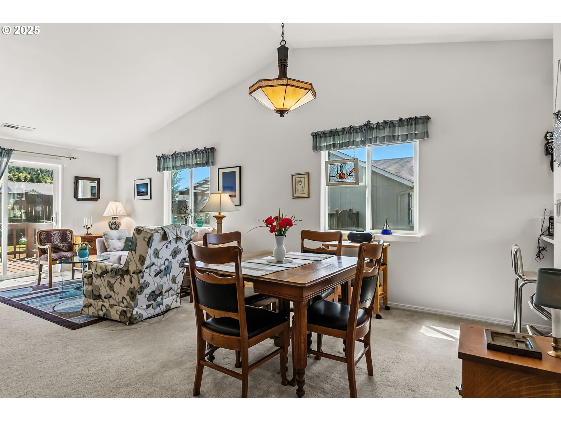 1933 South 58th Street Springfield, OR 97478 - Photo 7 of 32 a view of a dining room with furniture and a window