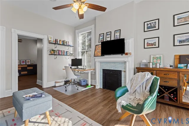a living room with furniture fireplace and flat screen tv