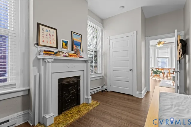 a living room with furniture and a fireplace