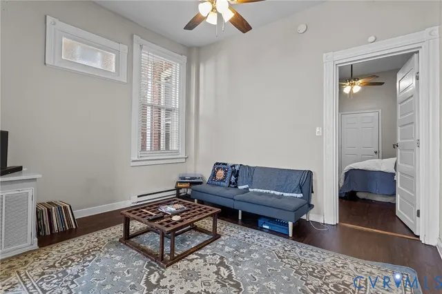 a living room with furniture and a window