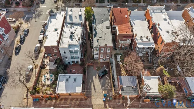an aerial view of houses with outdoor space