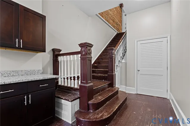 a view of an entryway with wooden floor