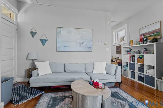 a living room with furniture and a rug
