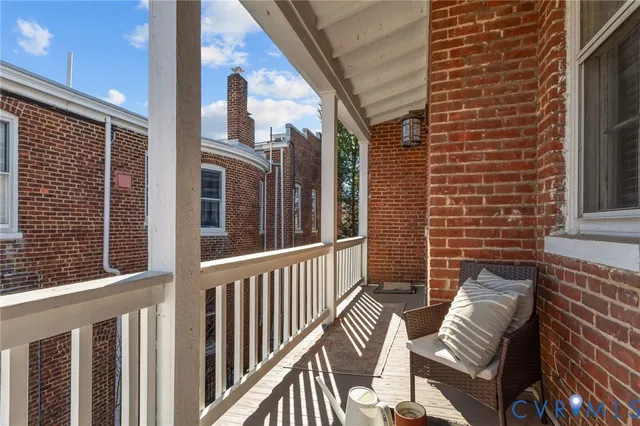 a view of a balcony with chairs