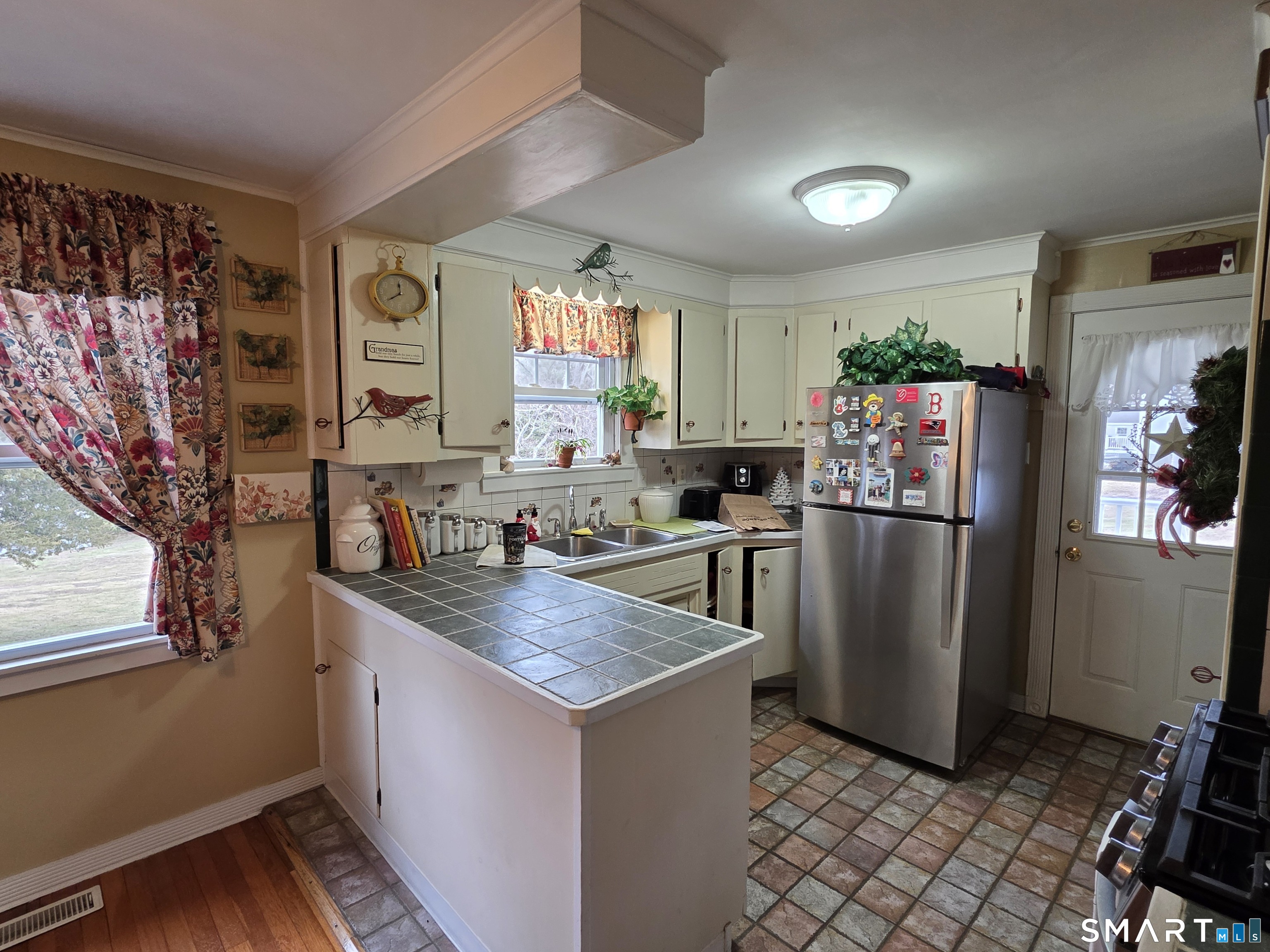 22 Pond Road Franklin, CT 06254 - Photo 11 of 34 a kitchen with stainless steel appliances granite countertop a refrigerator sink and stove