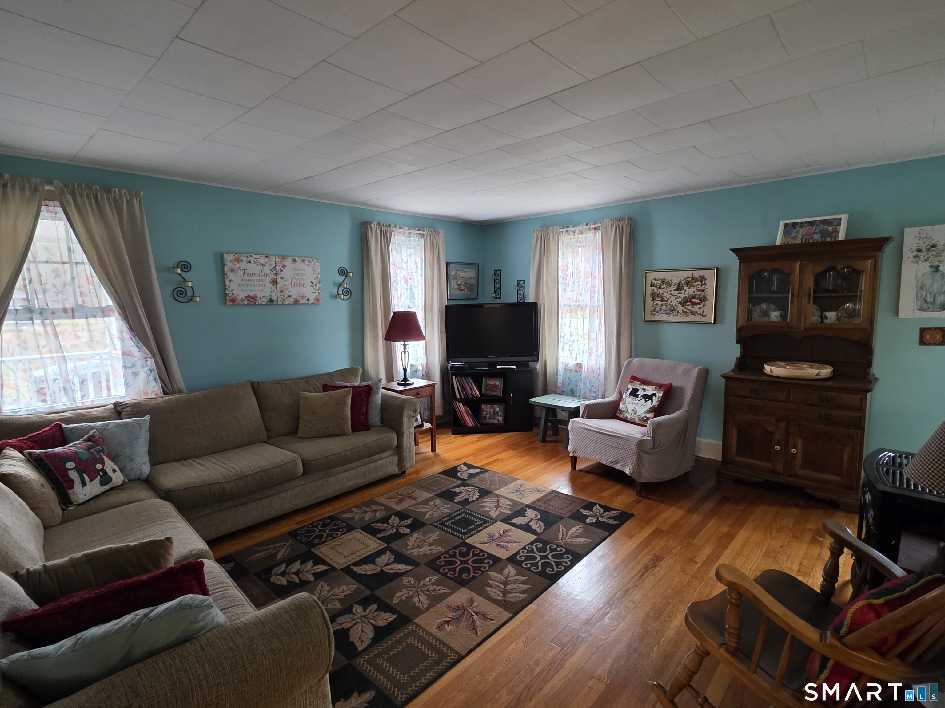 22 Pond Road Franklin, CT 06254 - Photo 12 of 34 a living room with furniture and a flat screen tv