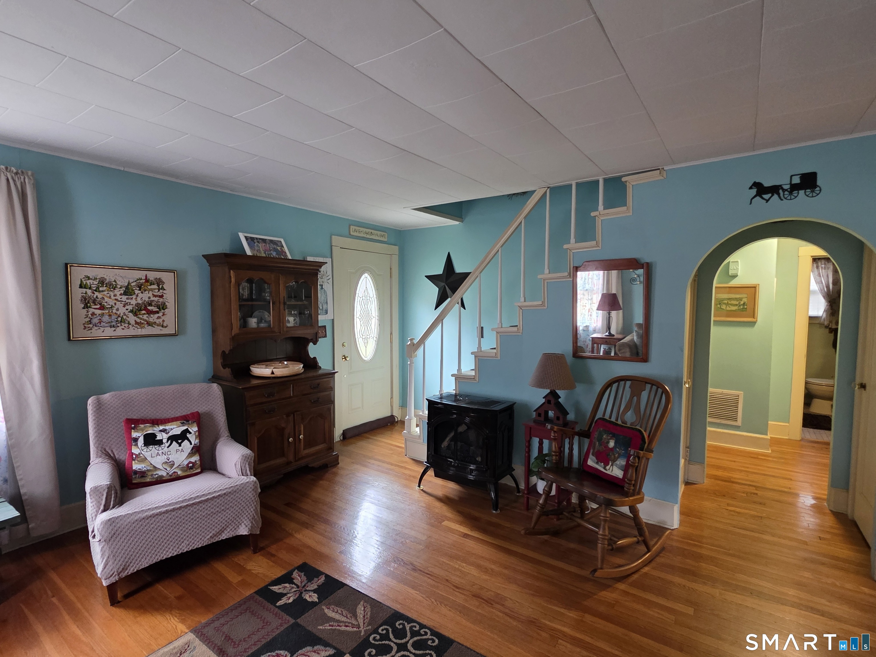 22 Pond Road Franklin, CT 06254 - Photo 13 of 34 a living room with furniture and a fireplace