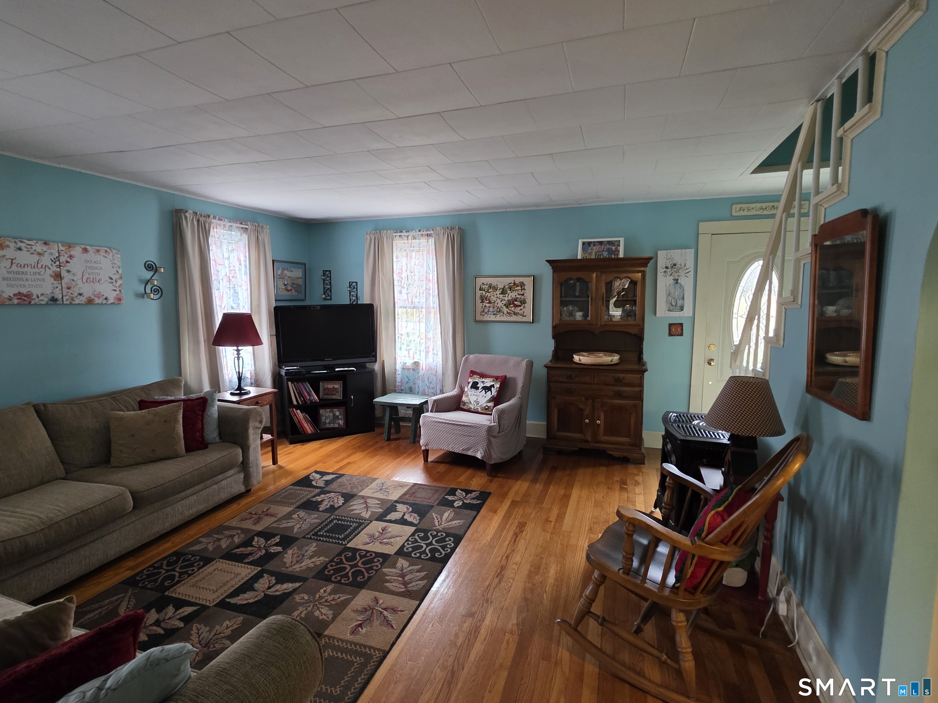 22 Pond Road Franklin, CT 06254 - Photo 14 of 34 a living room with furniture and a flat screen tv