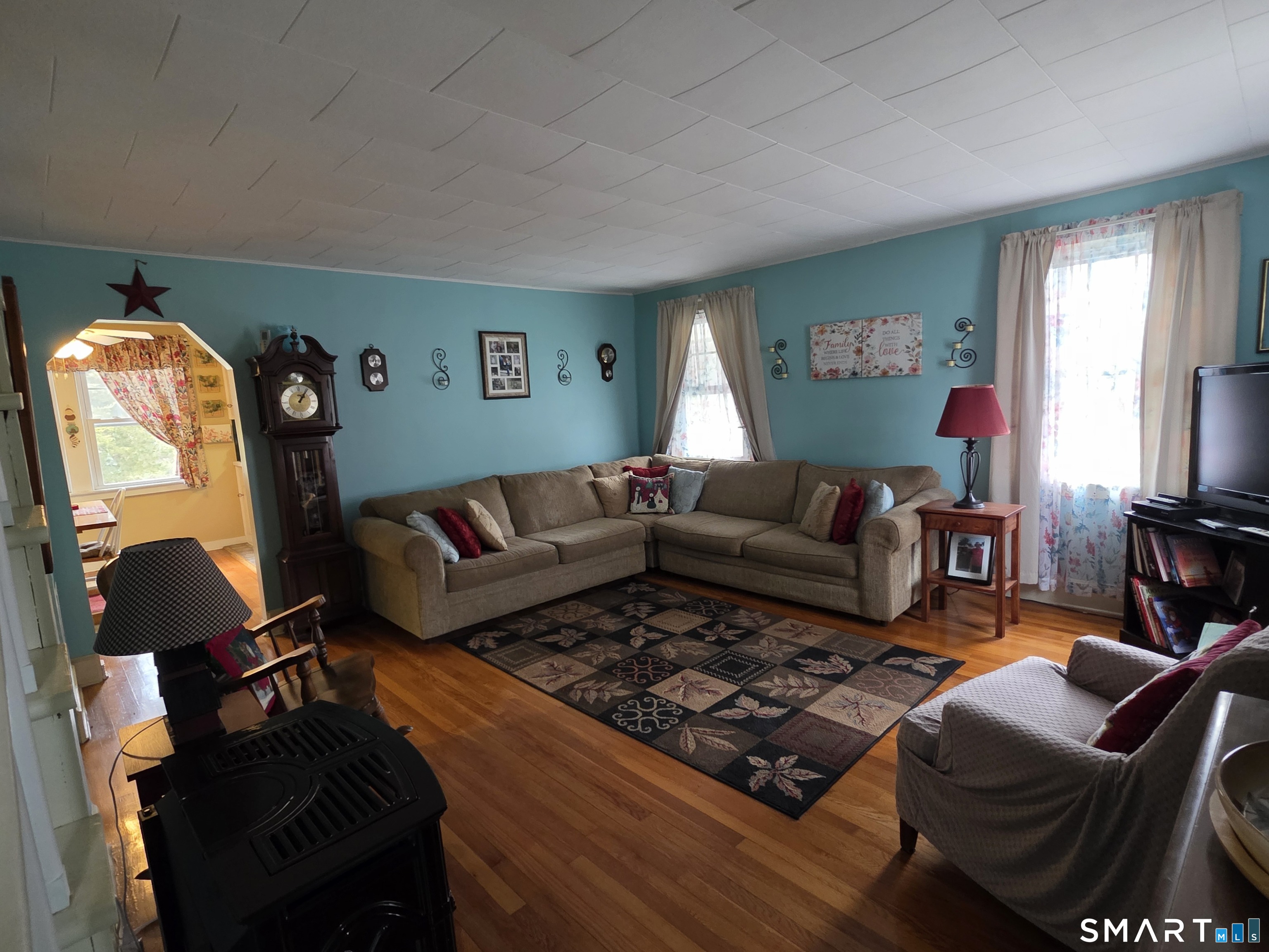 22 Pond Road Franklin, CT 06254 - Photo 15 of 34 a living room with furniture and a flat screen tv